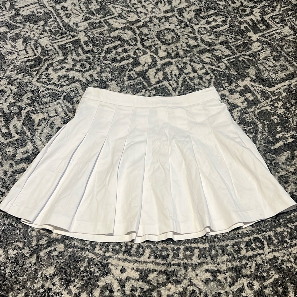 White pleated mini skirt